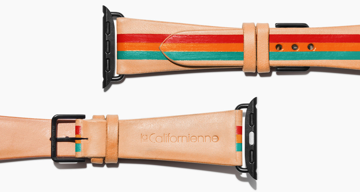 Strap for the Apple Watch handmade of natural vegetable tanned leather with three hand-painted stripes in red orange and aqua in men's length which measures: 105mm / 75mm. Hardware offered in gold, black, or silver in the small and large size. Price $400 plus shipping. Please reach out with any questions.