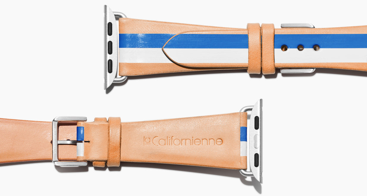 Strap for the Apple Watch handmade of natural vegetable tanned leather with two hand-painted stripes in bright blue and white in women's length which measures: 105mm and 65mm. Hardware offered in gold, black, or silver in the small and large size. Price $400 plus shipping. Please reach out with any questions. 