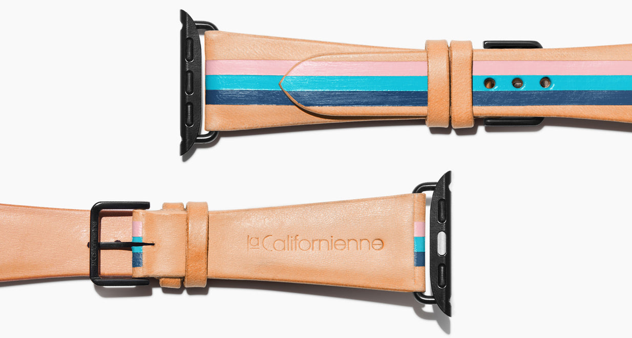 Strap for the Apple Watch handmade of natural vegetable tanned leather with three hand-painted stripes in petal pink, aqua, and navy in women's length which measures: 105mm and 65mm. Hardware offered in gold, black, or silver in the small and large size. Price $400 plus shipping. Please reach out with any questions. 