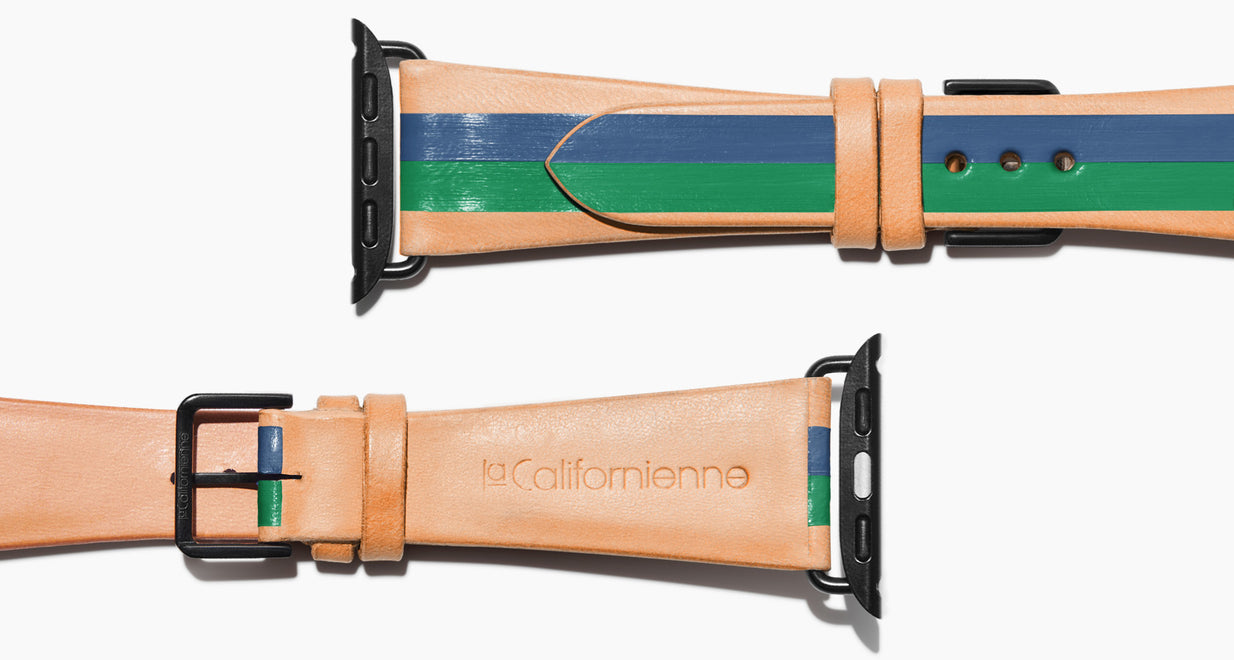Strap for the Apple Watch handmade of natural vegetable tanned leather with two hand-painted stripes in navy blue and green in men's length which measures: 105mm and 75mm. Hardware offered in gold, black, or silver in the small and large size. Price $400 plus shipping. Please reach out with any questions. 