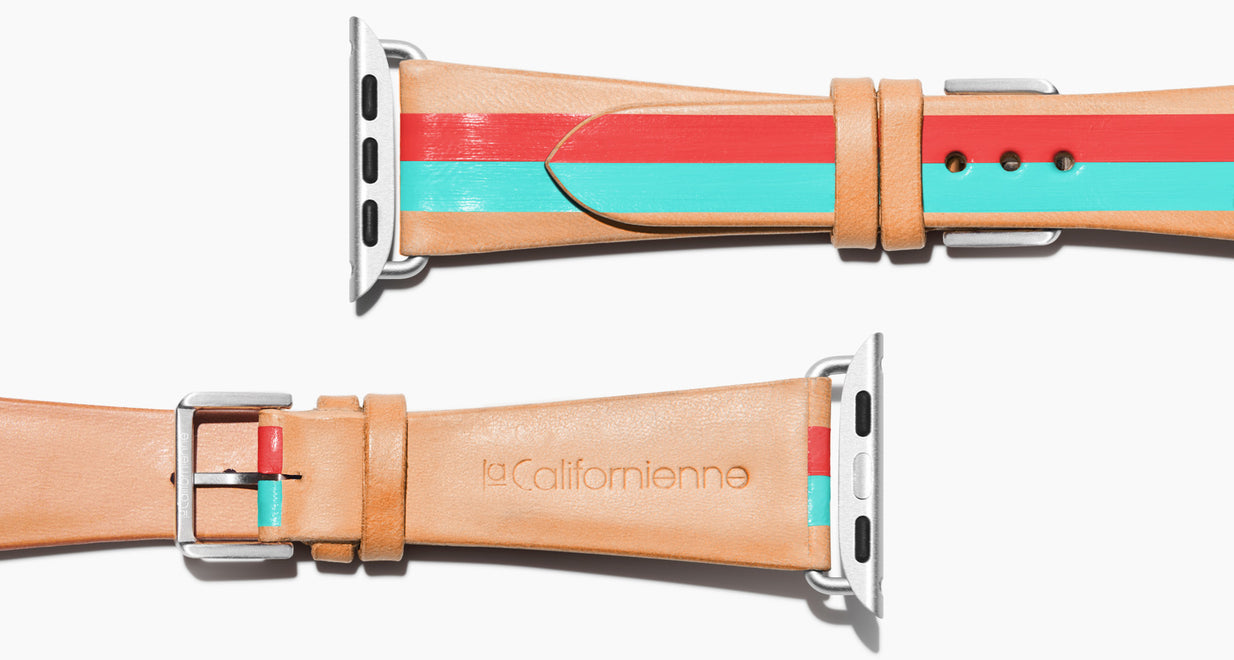 natural vegetable tanned leather with two hand-painted stripes in red mad aqua in women's length which measures: 105mm and 65mm. Hardware offered in gold, black, or silver in the small and large size. Please reach out with any questions. Price $400 plus shipping.