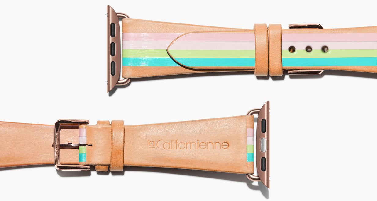 Strap for the Apple Watch handmade of natural vegetable tanned leather with four hand-painted stripes in petal pink, shell pink, light lime green, aqua in women's length which measures: 105mm and 65mm. Hardware offered in gold, black, or silver in the small and large size. Price $400 plus shipping. Please reach out with any questions. 