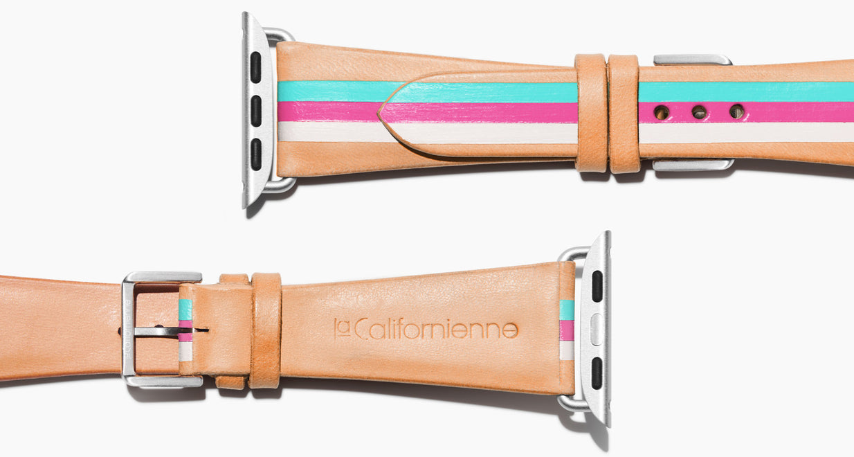 Strap for the Apple Watch handmade of natural vegetable tanned leather with three hand-painted stripes in aqua, hot pink, and white in women's length which measures: 105mm and 65mm. Hardware offered in gold, black, or silver in the small and large size. Price $400 plus shipping. Please reach out with any questions. 