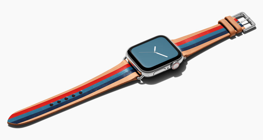 Strap for the Apple Watch handmade of natural vegetable tanned leather with three hand-painted stripes in red steel blue and navy in men's length which measures: 105mm / 75mm. Hardware offered in gold, black, or silver in the small and large size. Price $400 plus shipping. Please reach out with any questions. 