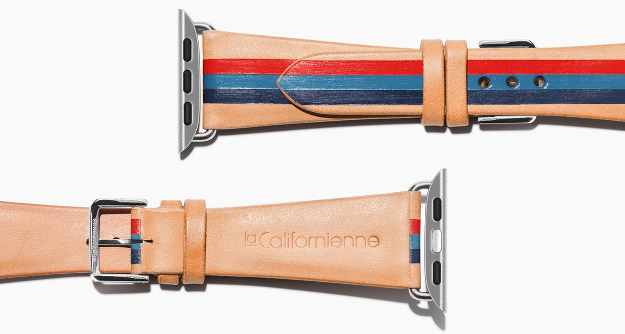 Strap for the Apple Watch handmade of natural vegetable tanned leather with three hand-painted stripes in red steel blue and navy in men's length which measures: 105mm / 75mm. Hardware offered in gold, black, or silver in the small and large size. Price $400 plus shipping. Please reach out with any questions. 