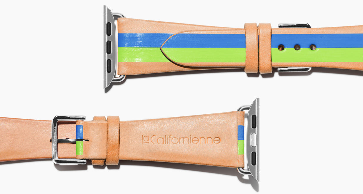 Strap for the Apple Watch handmade of natural vegetable tanned leather with two hand-painted stripes in rime green and bight blue in men's length which measures: 105mm / 75mm.  Hardware offered in gold, black, or silver in the small and large size. Price $400 plus shipping. Please reach out with any questions. 