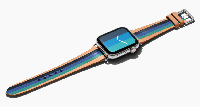 Strap for the Apple Watch handmade of natural vegetable tanned leather with three hand-painted stripes in navy, bright blue, teal in men's length which measures: 105mm / 75mm. Hardware offered in gold, black, or silver in the small and large size. Price $400 plus shipping. Please reach out with any questions. 