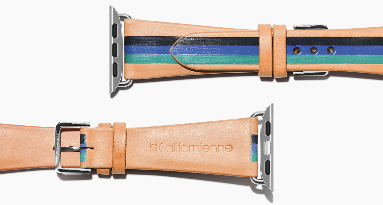 Strap for the Apple Watch handmade of natural vegetable tanned leather with three hand-painted stripes in navy, bright blue, teal in men's length which measures: 105mm / 75mm. Hardware offered in gold, black, or silver in the small and large size. Price $400 plus shipping. Please reach out with any questions. 