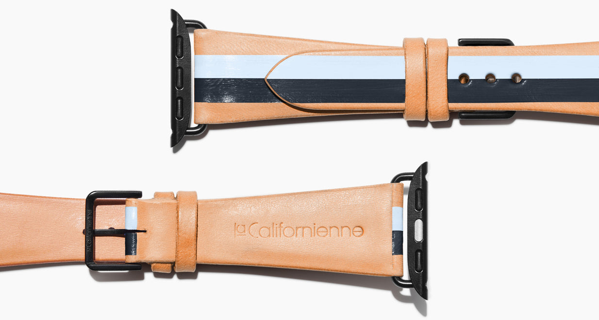 Strap for the Apple Watch handmade of natural vegetable tanned leather with two hand-painted stripes in black and white in men's length which measures: 105mm / 75mm.  Hardware offered in gold, black, or silver in the small and large size. Price $400 plus shipping. Please reach out with any questions. 