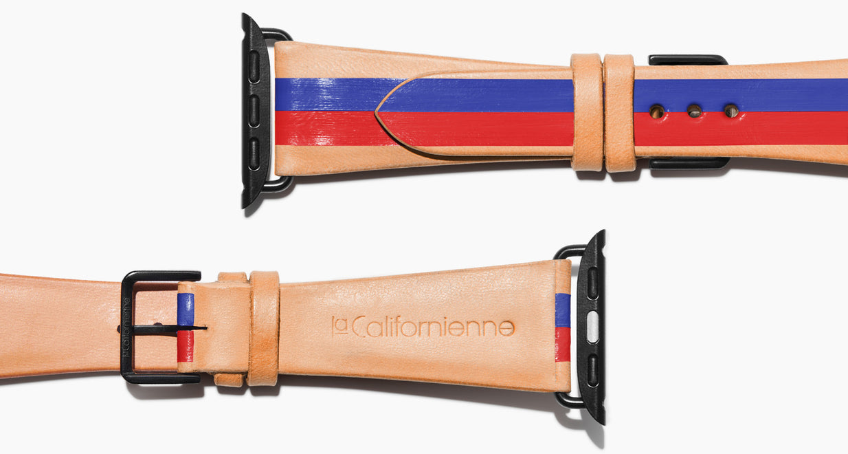 Strap for the Apple Watch handmade of natural vegetable tanned leather with two hand-painted stripes in blue and red in men's length which measures: 105mm / 75mm.  Hardware offered in gold, black, or silver in the small and large size. Price $400 plus shipping. Please reach out with any questions. 