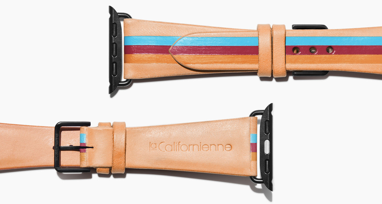 Strap for the Apple Watch handmade of natural vegetable tanned leather with three hand-painted stripes in light blue, burgundy, mustard caramel in men's length which measures: 105mm / 75mm. Hardware offered in gold, black, or silver in the small and large size. Price $400 plus shipping. Please reach out with any questions. 